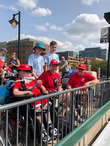 Bystanders watch a baseball game at The Miracle League